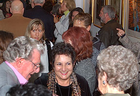 Graciela Boulanger talks with friends at Gallery 444